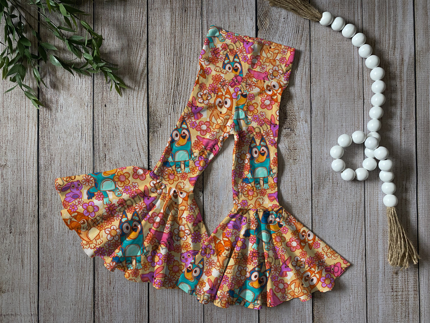 Orange flower bell bottoms