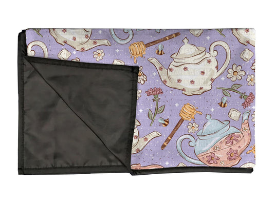 Purple tea playmat, swaddle, and blanket